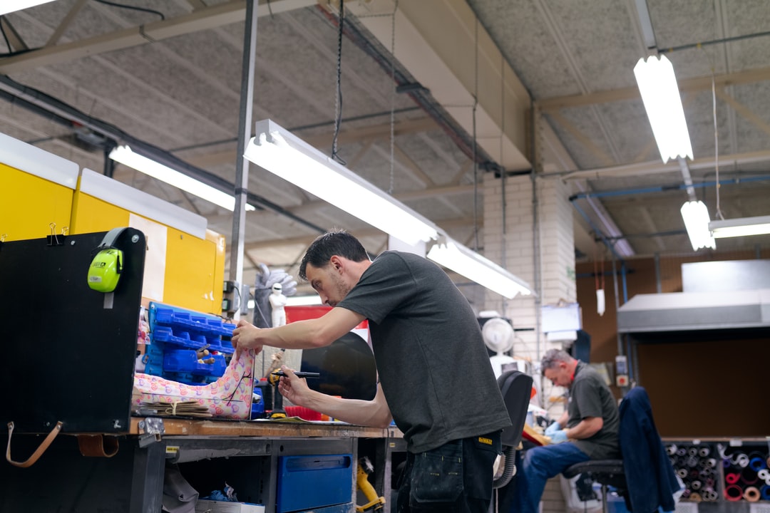 Male orthotic technician engineer makes personalised leg cast